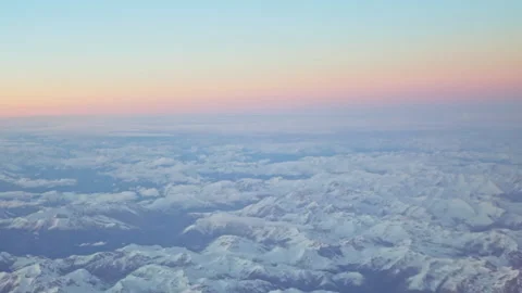 Mountains from plane window at sunset Stock Footage 148990968