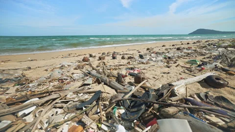 Mountains of Plastic Waste Cover the Sandy Beach of the Ocean Shoreline. Stock Footage 286214068