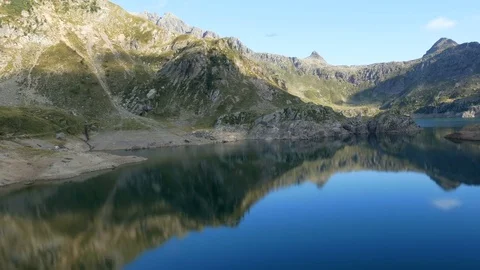 Mountains reflect on lake Gemelli basin on the Bergamo Alps. Video stock 79649770