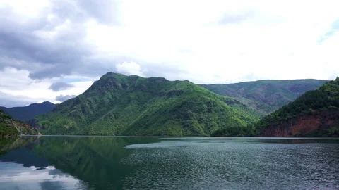 Mountains reflecting in Komani Lake, Albania. Stock Footage
