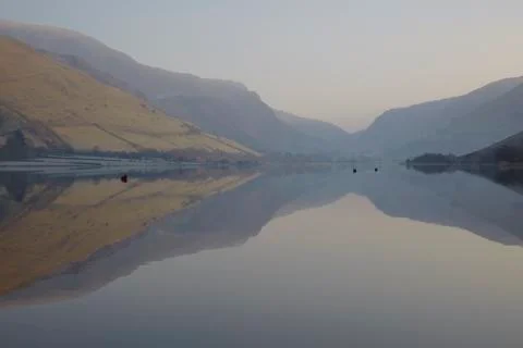 Mountains' reflections on the water Stock Photos