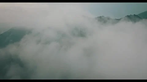 Mountains revealing from clouds Stock Footage 131736345
