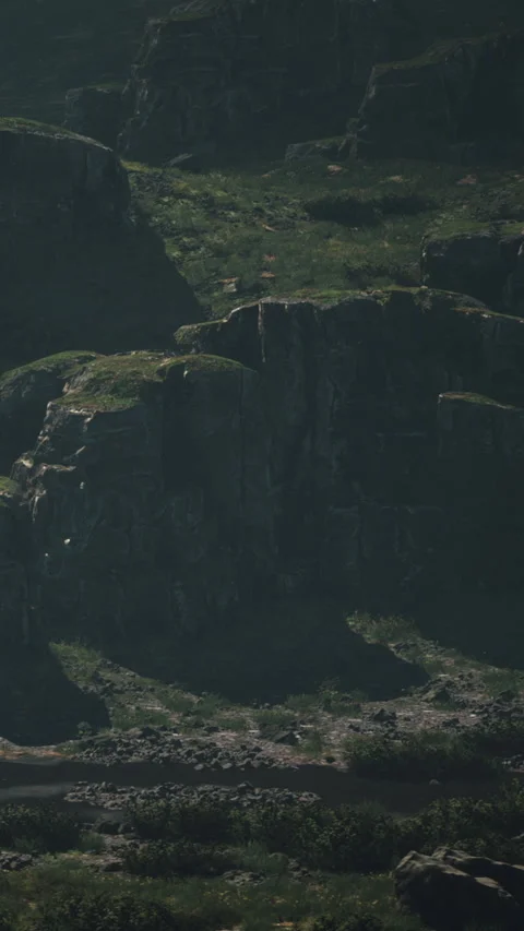 Mountains rise steeply with dark shadows created by midday sun rays Stock Footage 340881888
