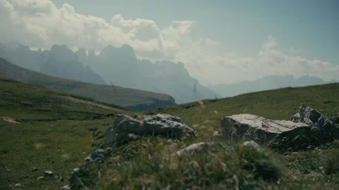 Mountains Rising Above High Alpine Meadows Under a Sunny Summer Sky Vidéo 331169906