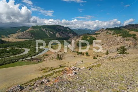 Mountains river valley forest clouds Stock Photos