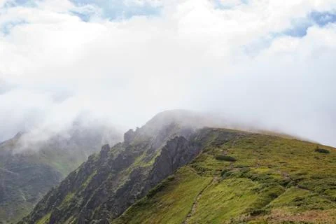 Mountains &amp; Rocks in clouds Stock Photos