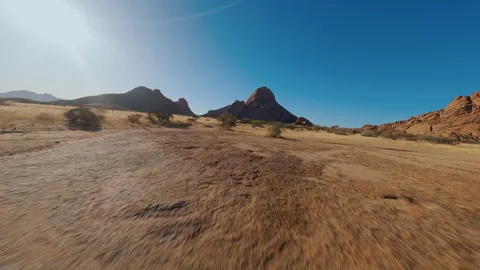 Mountains in sandy desert view from FPV drone Stock Footage 297254629