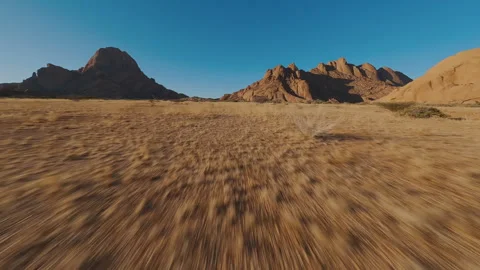 Mountains in sandy desert view from FPV drone Stock Footage 297254788