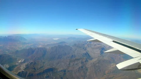 Mountains seen from an airplane window Stock Footage 132426780