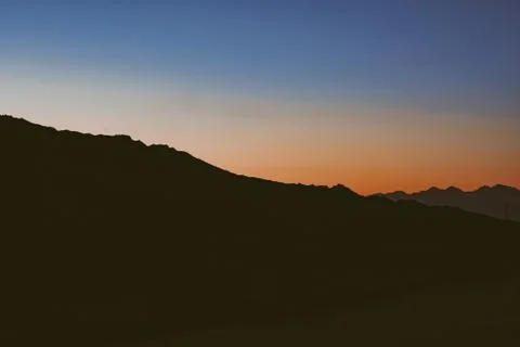 Mountains in the setting sun Stock Photos