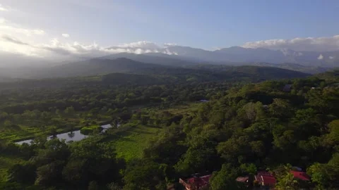 MOUNTAINS SHELTERED BY CLOUDS IN SUMMER Stock Footage 318662993