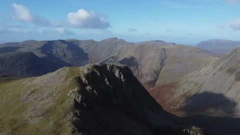 Mountains on the slopes of Scarfell Pike with rolling cloud shadows Stock Footage 263443333