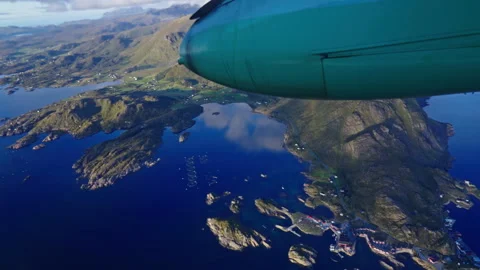 Mountains, small settlements and the ocean seen from an airplane Stock Footage 268437111