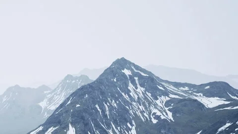Mountains with snow and clouds in the background during daytime Stock Footage 345057524