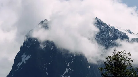 Mountains, snow and clouds. Bird flying around Stock Footage 107218169