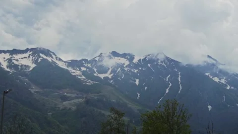 Mountains with snow and greenery Stock Footage 204003311