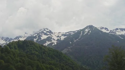 Mountains with snow and greenery Stock Footage 204003330