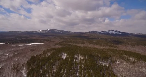 Mountains. Snow-covered forest at the foot of the mountain. Stock Footage 89729520