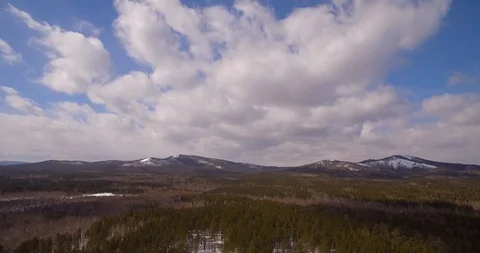 Mountains. Snow-covered forest at the foot of the mountain. Stock-Footage 89736357