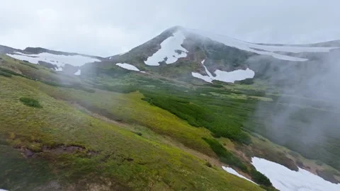 Mountains spring snow stone rock clouds sky background Stock Footage 277108235