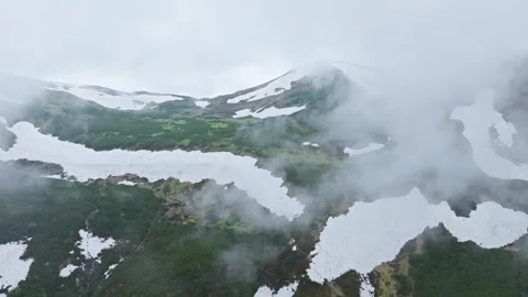 Mountains spring snow stone rock clouds sky background Stock Footage 277108245