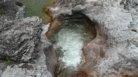 Mountains stream with rocks flowing into a pool Stock-Footage 211453782