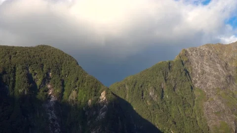 Mountains in the sun and big cloud over the cliff Stock Footage 132062789