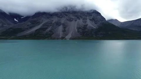 Mountains Surrounded By Clouds And Turquoise Water, Aerial Stock Footage 255211068