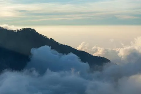 Mountains surrounded by clouds. Trek to Mount Rinjani, Lombok, Indonesia Stock Photos