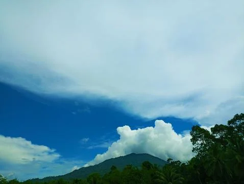 Mountains with thin sky and clouds Stock Photos