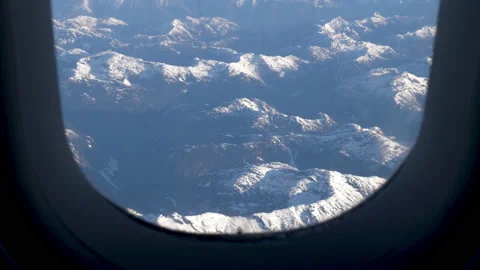 Mountains Through Airplane Window Stock Footage 135169527