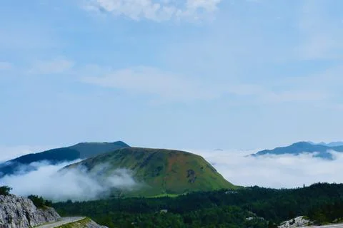 Mountains top covered in low clouds. Pyrenees, France. Aerial view Stock Photos