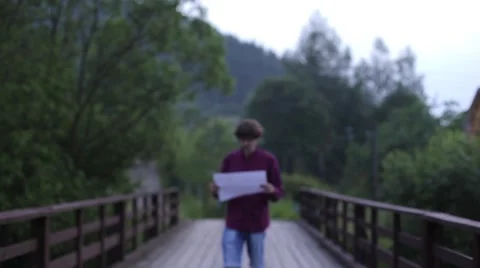 In the mountains, Tourist looking at a map Stock Footage 64684388