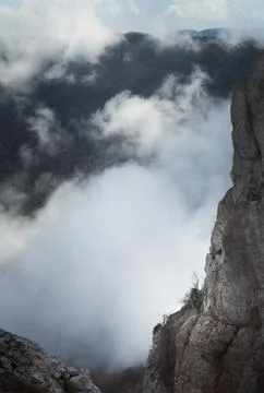 Mountains tower over the clouds Stock Photos