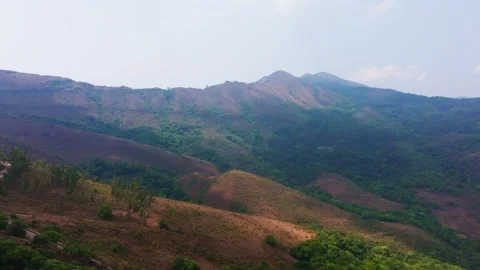 Mountains with trees, sky, haze and road at Western Ghats, Inam Dattathreya Stock Footage 336750003