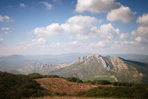 Mountains under the blue sky with clouds Stock Photos