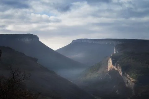 Mountains under the blue sky with clouds Stock Photos