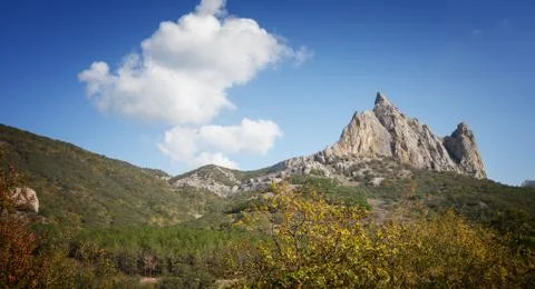 Mountains under the blue sky with clouds Stock Photos