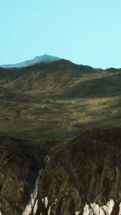 Mountains under clear sky with visible terrain and shadows during daylight 動画素材 338350304
