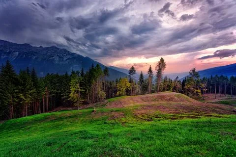 Mountains under a dramatic sky at sunset 写真素材