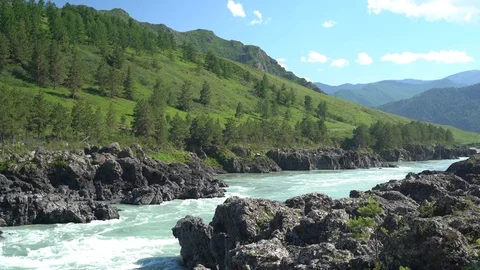 Mountains valley and rapid river flow through volcanic rocks Stock Footage 113139716