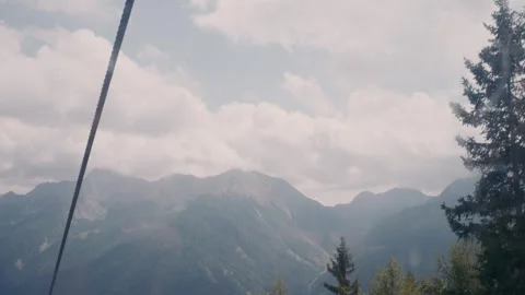Mountains View from a Cable Car Lift Rising Through the Green Valley Alps 库存影片 331168376