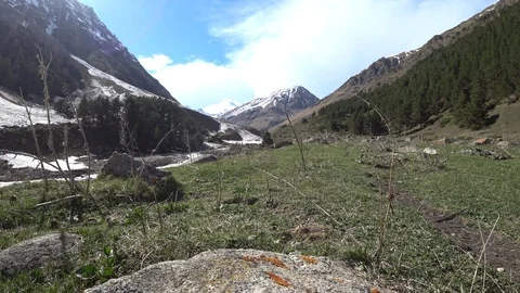 Mountains view with a clouded blue sky background Stock Footage 90491960