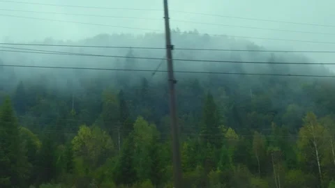 Mountains view through train window. Passenger train compartment passing by Stock Footage 264273955