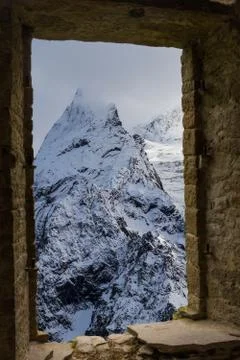 Mountains winter snow wibdow Stock Photos