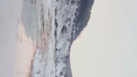 Mountains in winter. Stunning winter mountain with clear lake and blue sky. Stock Footage 146981064