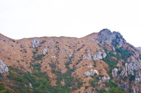 Mountainside of the high peak Stock Photos