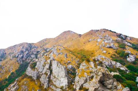 Mountainside of the high peak Stock Photos
