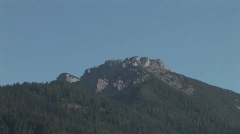 Mountaintop cliffs on a mountain in the alps, Austria, blue sky. Stock Footage 42773042