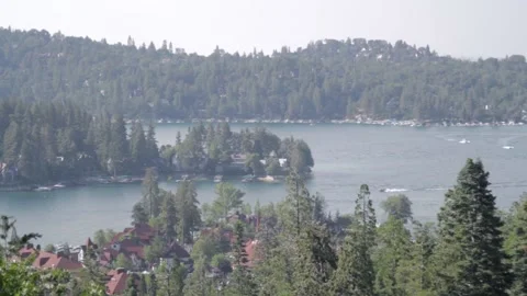 Mountainview of Arrowhead Lake as boats drive by Stock Footage